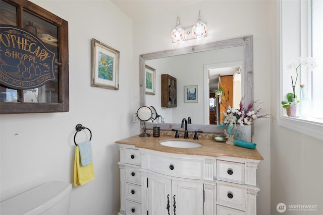 bathroom with vanity and toilet