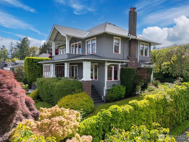 4015 S Andover St, Seattle, WA 98118 - view of property exterior with a chimney, stairway, a balcony, and covered porch