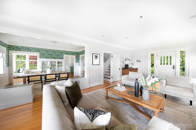4015 S Andover St, Seattle, WA 98118 - living room featuring healthy amount of natural light, light wood finished floors, stairs, and crown molding