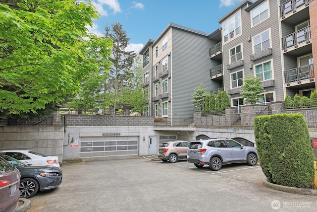 view of property with uncovered parking
