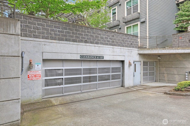 garage with concrete driveway