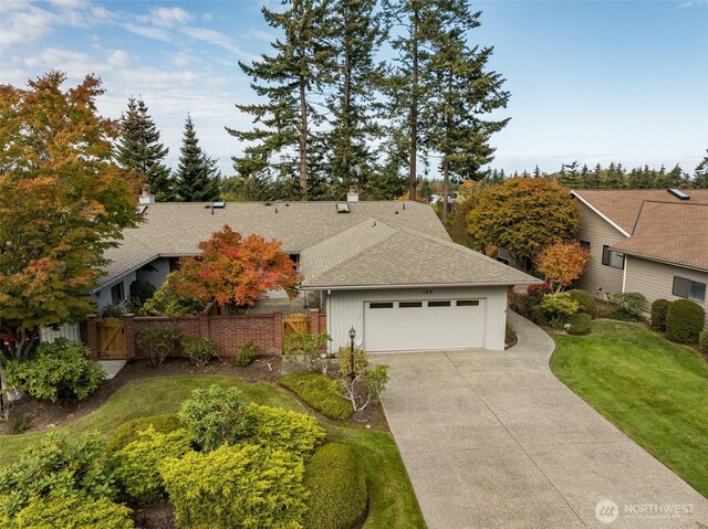 169 Fairway Dr, Sequim, WA 98382 - view of front of home featuring a gate, an attached garage, driveway, and fence