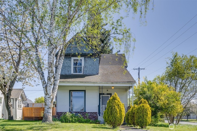 2231 Highland Ave, Everett, WA 98201 - view of front facade featuring covered porch, a shingled roof, and a front lawn