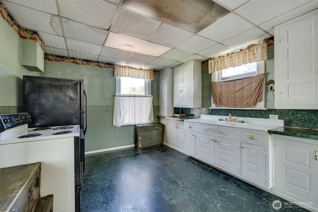 2231 Highland Ave, Everett, WA 98201 - interior space with white cabinets, electric range, and a wealth of natural light