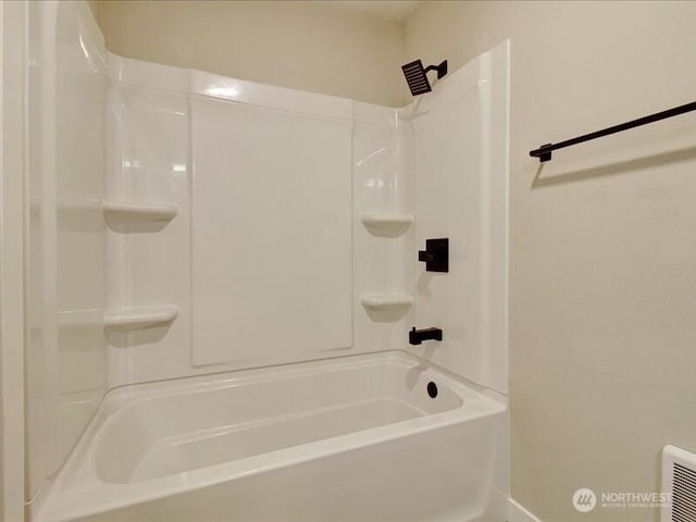 bathroom with visible vents, baseboards, and a shower