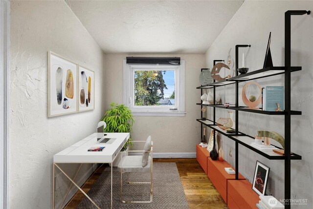 office with baseboards and wood finished floors