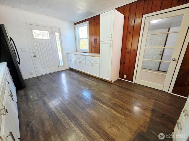 6818 Olympic Hwy, Aberdeen, WA 98520 - foyer featuring dark wood-type flooring and wooden walls