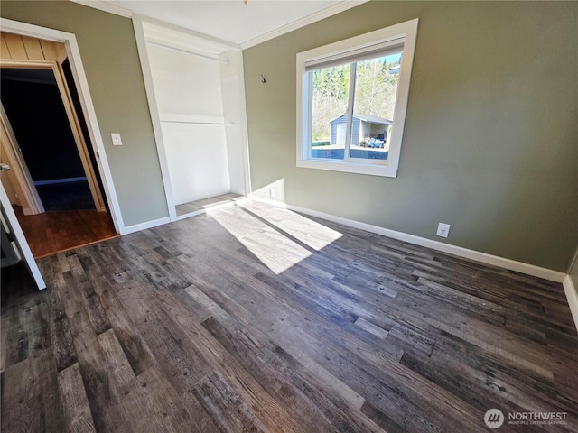 6818 Olympic Hwy, Aberdeen, WA 98520 - unfurnished bedroom with crown molding, baseboards, and dark wood finished floors