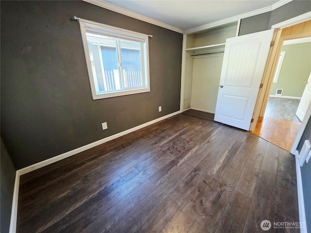 6818 Olympic Hwy, Aberdeen, WA 98520 - unfurnished bedroom with dark wood-style flooring, visible vents, baseboards, a closet, and crown molding