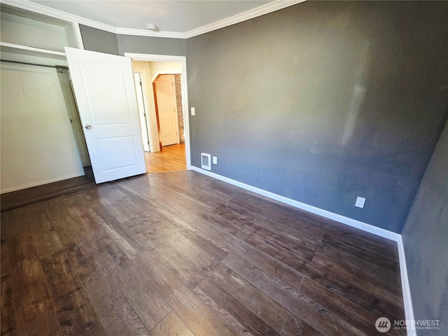 6818 Olympic Hwy, Aberdeen, WA 98520 - unfurnished bedroom featuring baseboards, wood finished floors, and visible vents