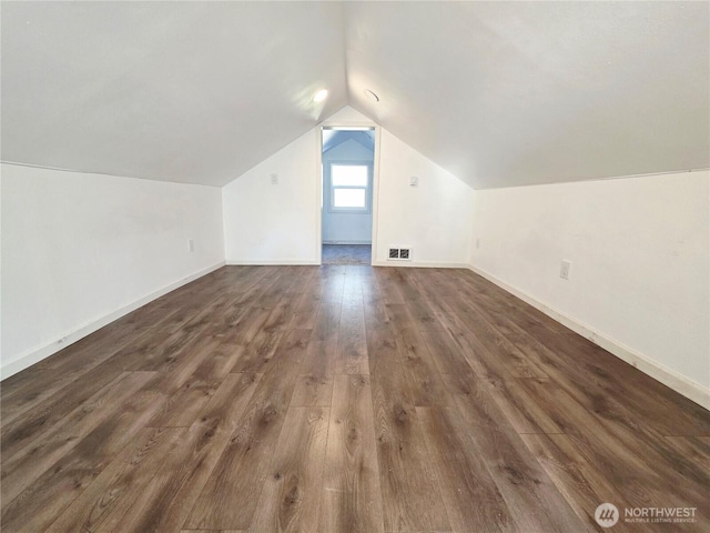 6818 Olympic Hwy, Aberdeen, WA 98520 - additional living space featuring baseboards, vaulted ceiling, visible vents, and dark wood-type flooring