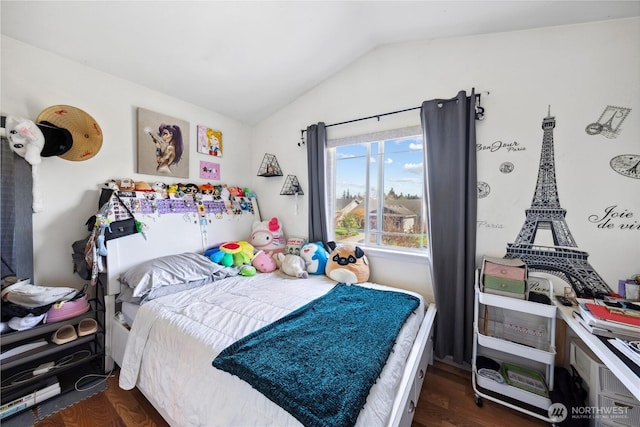 bedroom with lofted ceiling and dark wood-style floors
