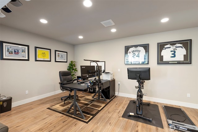 office featuring recessed lighting, light wood-style flooring, visible vents, and baseboards