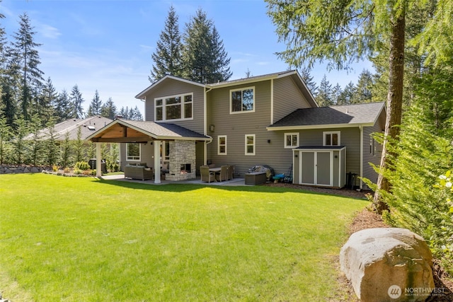 rear view of house featuring a lawn, outdoor lounge area, a patio, and a storage shed