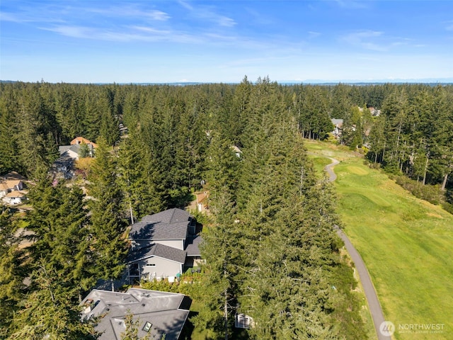 bird's eye view featuring a forest view
