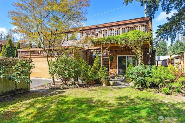 view of front of property with a front yard, fence, and a deck