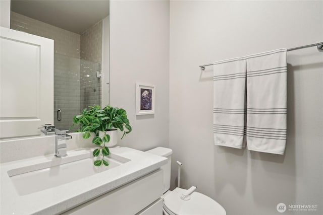 full bath featuring a shower stall, toilet, and vanity