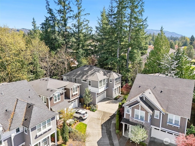 birds eye view of property featuring a mountain view and a residential view