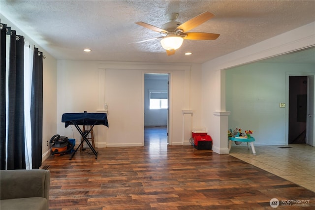 775 S 4th Ave, Othello, WA 99344 - unfurnished room with wood finished floors, recessed lighting, a textured ceiling, a ceiling fan, and baseboards