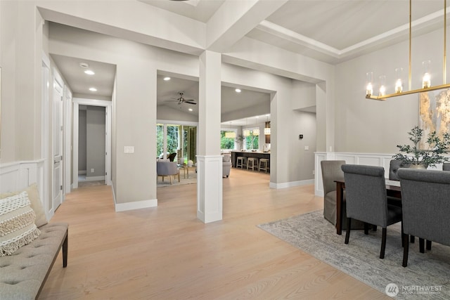 dining room with light wood finished floors, ceiling fan with notable chandelier, ornate columns, baseboards, and recessed lighting