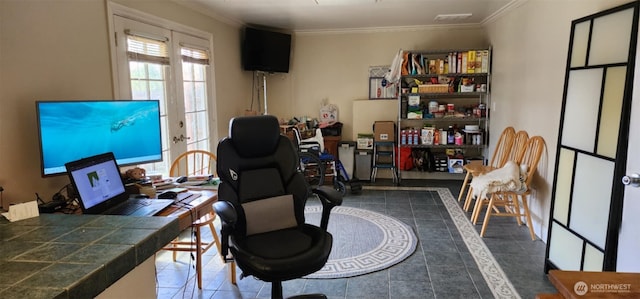 home office with dark tile patterned flooring and crown molding