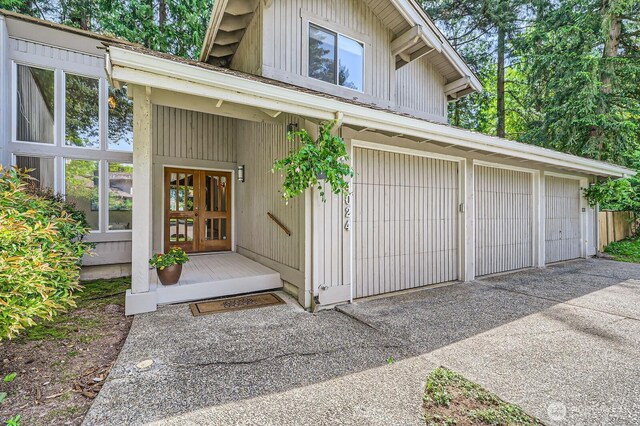 doorway to property with a garage