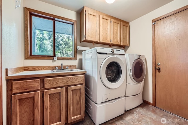 washroom with cabinet space and independent washer and dryer