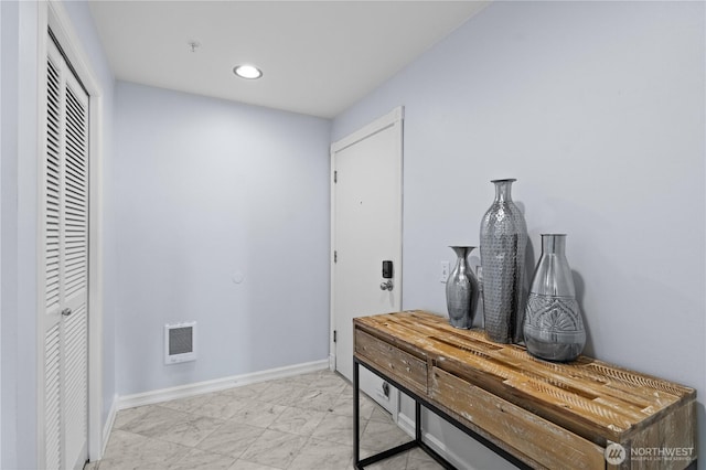 interior space featuring recessed lighting, baseboards, marble finish floor, and visible vents