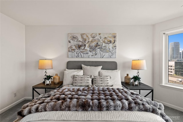 carpeted bedroom featuring baseboards