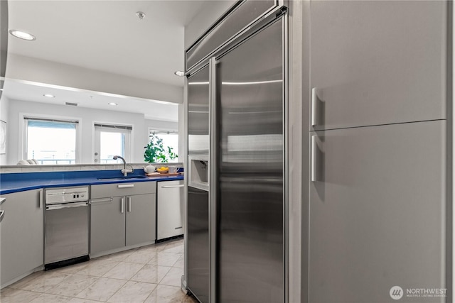 kitchen with a sink, recessed lighting, and appliances with stainless steel finishes