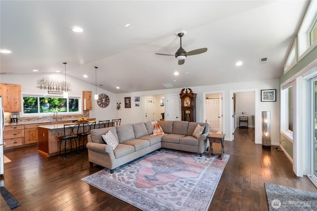 living room with a ceiling fan, recessed lighting, visible vents, vaulted ceiling, and dark wood-style floors
