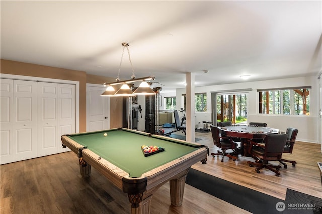 game room with pool table, plenty of natural light, and wood finished floors