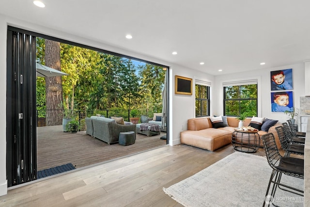living area with recessed lighting and hardwood / wood-style floors