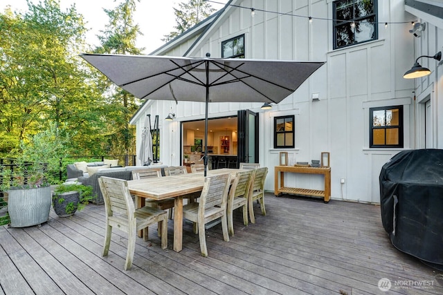 wooden deck featuring outdoor lounge area, outdoor dining space, and area for grilling