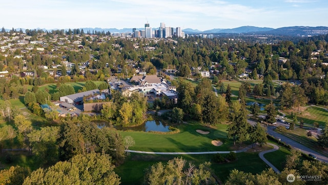 bird's eye view featuring golf course view and a water and mountain view