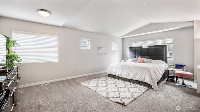 bedroom featuring baseboards, vaulted ceiling, and carpet