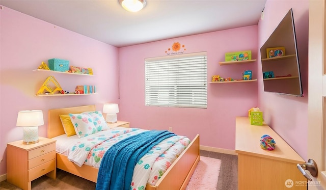 carpeted bedroom with baseboards