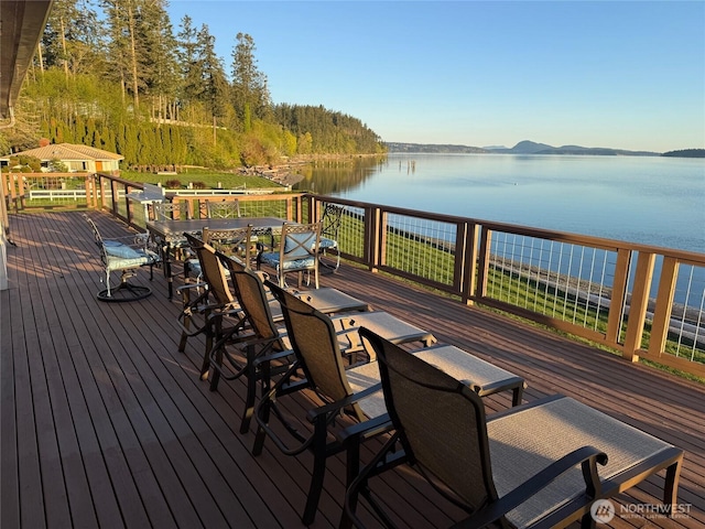 wooden deck featuring a water view