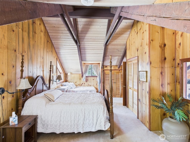 bedroom featuring lofted ceiling with beams, wooden walls, and carpet flooring