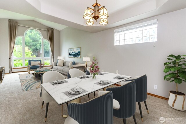 25171 13th Ave S, Des Moines, WA 98198 - dining area featuring light carpet, vaulted ceiling, baseboards, and a chandelier