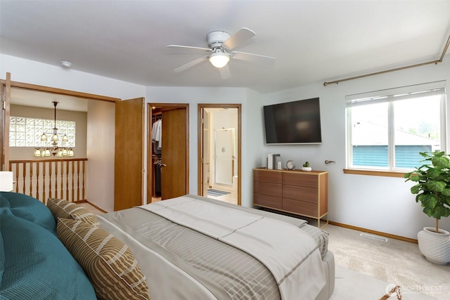 25171 13th Ave S, Des Moines, WA 98198 - bedroom with light colored carpet, baseboards, a chandelier, ensuite bath, and a ceiling fan