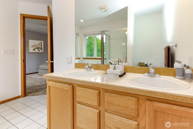 25171 13th Ave S, Des Moines, WA 98198 - bathroom with double vanity, tile patterned floors, and a stall shower