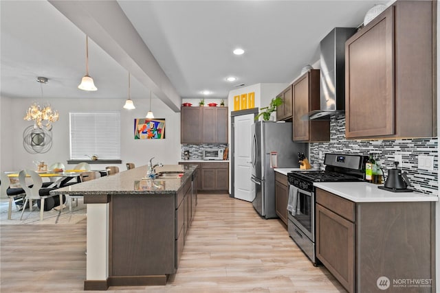 17431 3rd Ave SE, Bothell, WA 98012 - kitchen with appliances with stainless steel finishes, a sink, light wood-style flooring, decorative backsplash, and recessed lighting