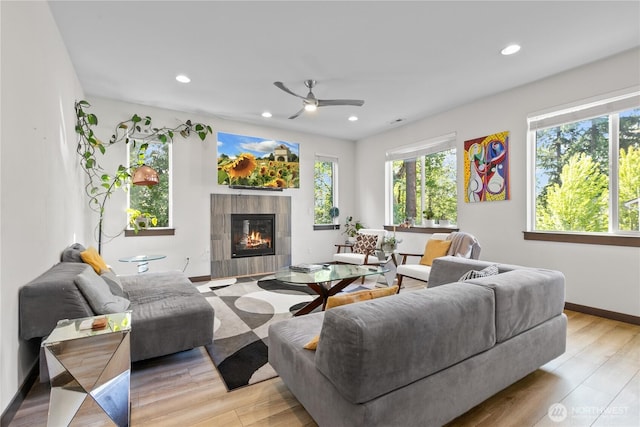 17431 3rd Ave SE, Bothell, WA 98012 - living area featuring plenty of natural light, a ceiling fan, a tile fireplace, light wood-type flooring, and recessed lighting