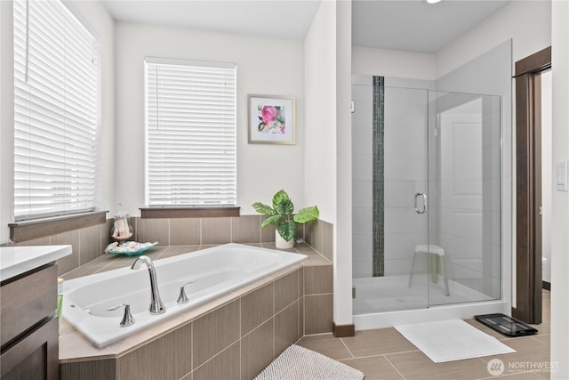 17431 3rd Ave SE, Bothell, WA 98012 - bathroom featuring a bath, a stall shower, vanity, tile patterned floors, and toilet