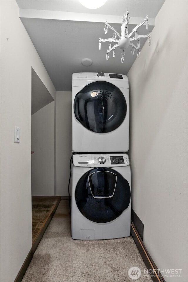 17431 3rd Ave SE, Bothell, WA 98012 - washroom featuring stacked washer / dryer, carpet flooring, and baseboards