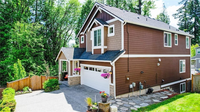 17431 3rd Ave SE, Bothell, WA 98012 - view of side of property with asphalt driveway, roof with shingles, and an attached garage