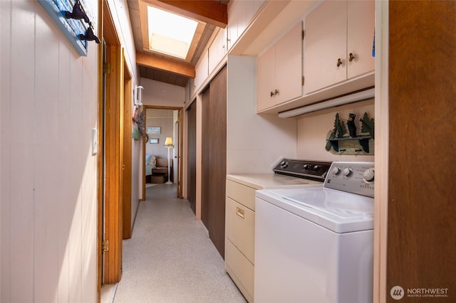 washroom with light colored carpet, separate washer and dryer, and cabinet space