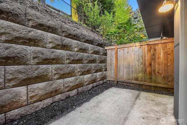 view of gate featuring a patio