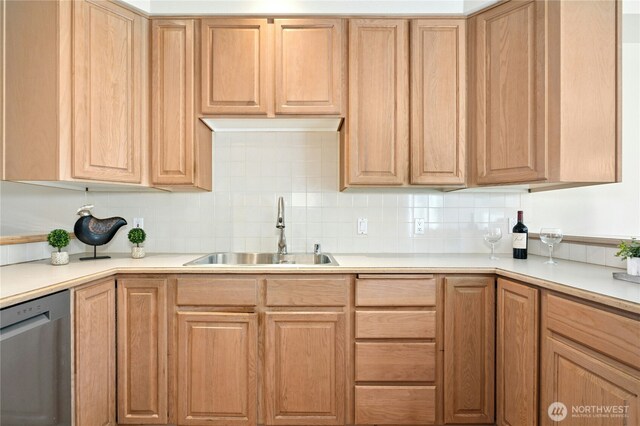 9821 NE Riverbend Dr Unit C102, Bothell, WA 98011 - kitchen with stainless steel dishwasher, a sink, tasteful backsplash, and light countertops
